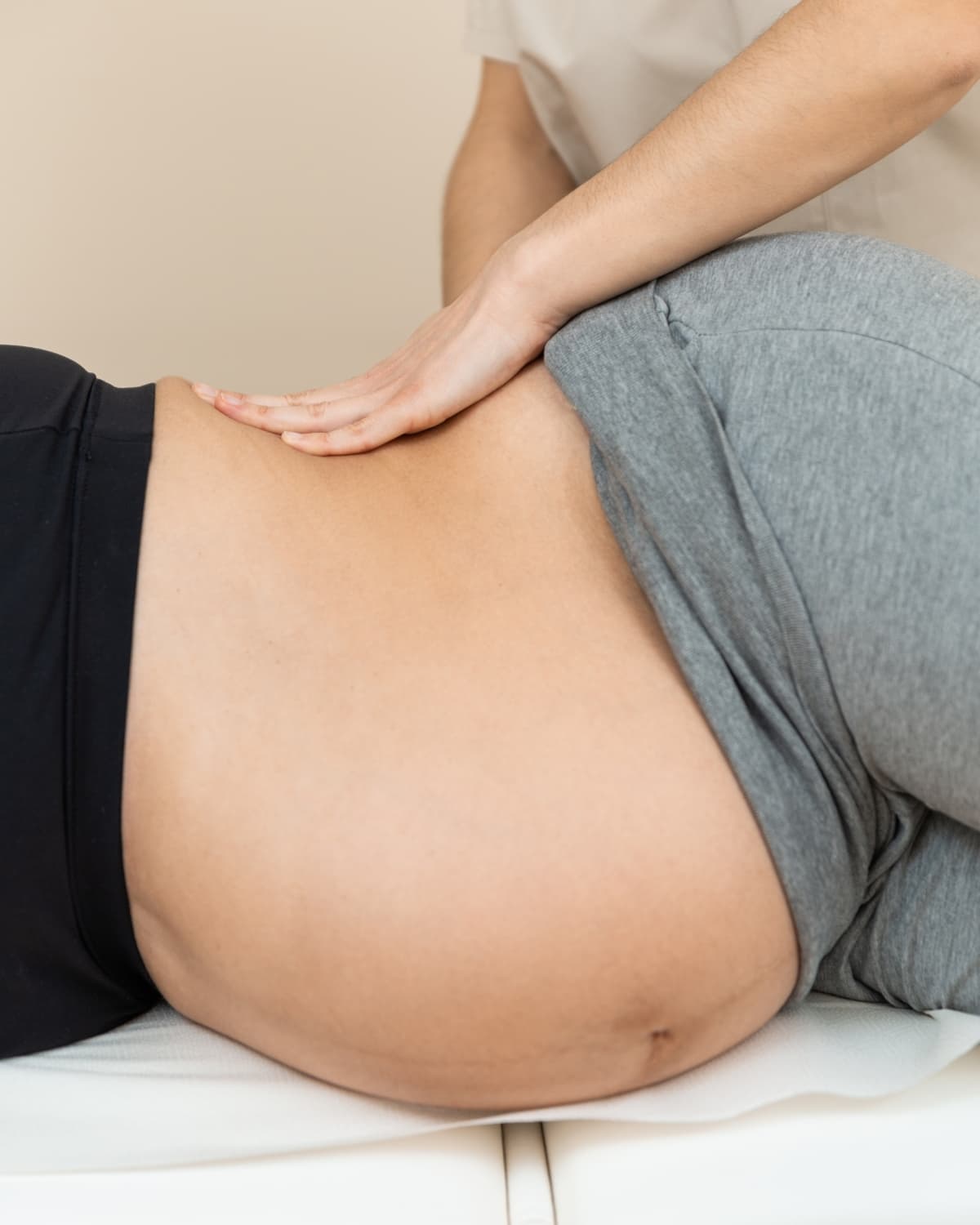 A calm, supported pregnancy massage, or the restful room