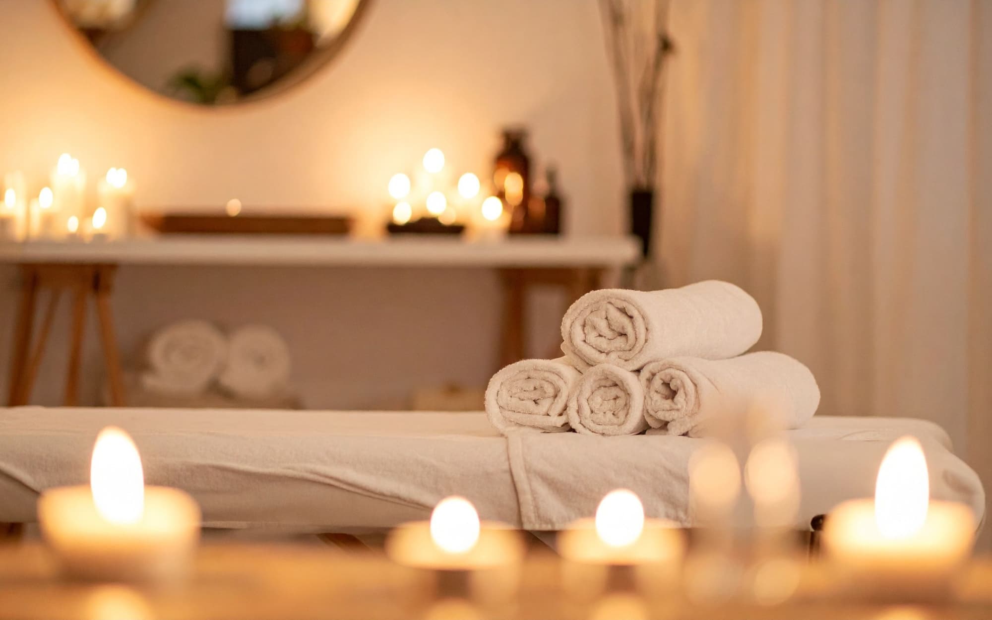 Warm, restful studio detail, candle, linen or plant